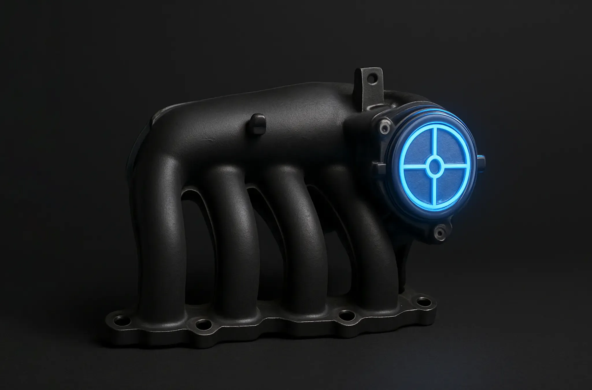 Intake manifold and swirl flap assembly lit on a dark bench